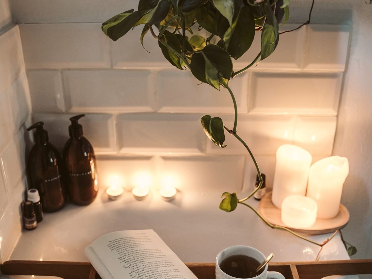 Quiet corner with candlelight, natural textures and a sculptural branch
